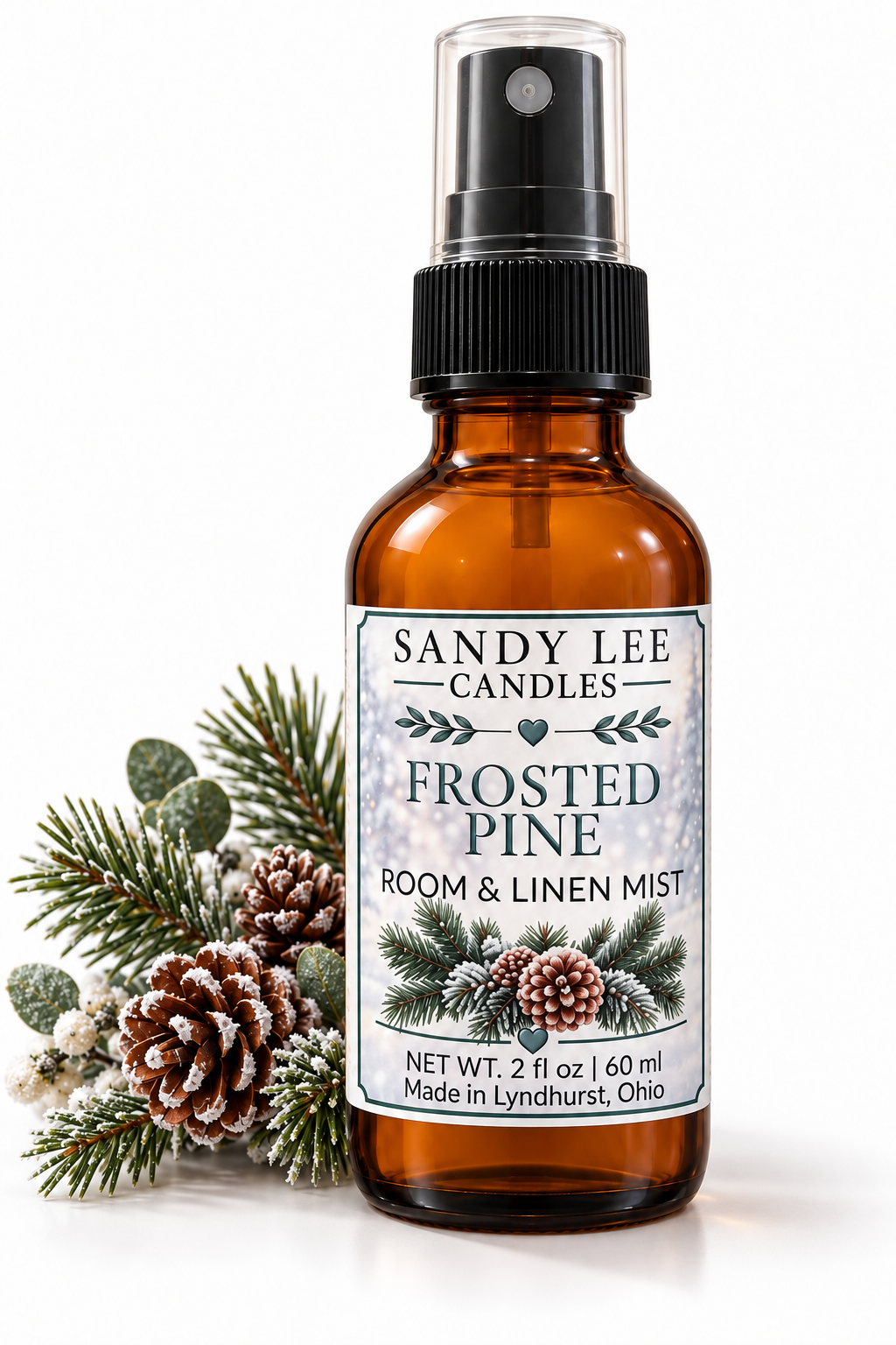 Frosted Pine Room & Linen Spray with pinecones and evergreen sprigs by Sandy Lee Candles.