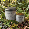 Sandy Lee Candles Woodland soy wax candles with packaging on a natural background